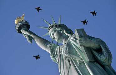 Lady liberty with Jets overhead.