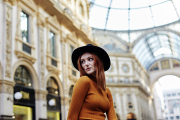 Woman pose for a portrait outside of the Galleria Vittorio Emanuele II in Milano Italy