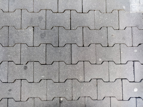 Pflastersteine Knochensteine auf deutscher Stra&szlig;e Gehweg