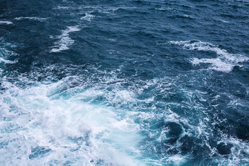 Fototapeta na wymiar Sea water splash with foamy wave. Water surface texture