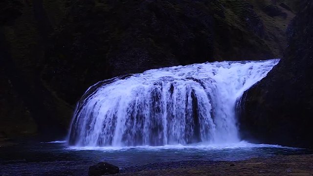 Stj&radic;&ge;rnarfoss Iceland amazing shot with the waterfall in a quite place for camping with the friends. Lovely place in nature.