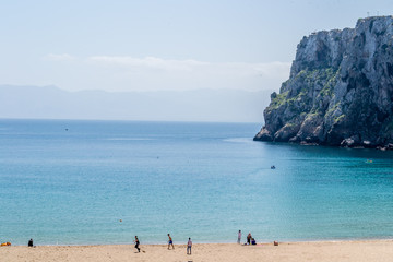 A wonderful view of Hoceima beach and waves and rocks in a sunny day