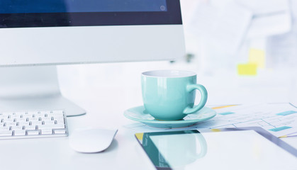 A cup of coffee on the office table