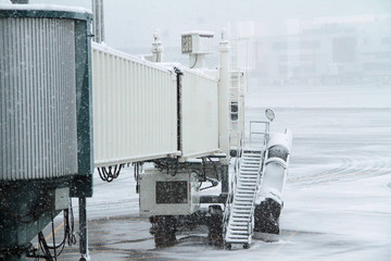 Obraz na płótnie Canvas Snowy Airplane Terminal at the Airport