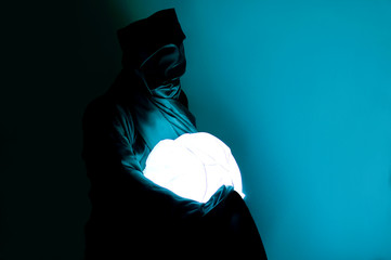 it, the man in the mantle carries the luminous sphere