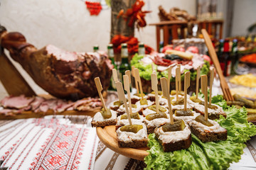 Catering banquet table with different food snacks and appetizers