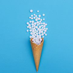 Ice cream cone with glitter white balls. Christmas decoration, winter holidays concept