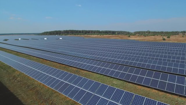 Solar battery farm on the field. Shot on drone