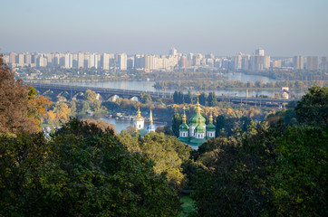 Beautiful landscape of the autumn city of Kiev. View of the river and church