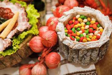 Catering banquet table with different food snacks and appetizers