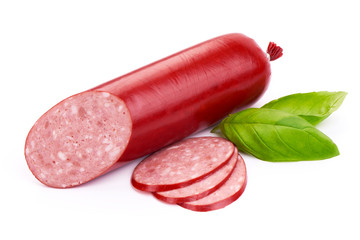 Turkey smoked Salami sausage with slices and basil leaves, close-up, isolated on a white background.