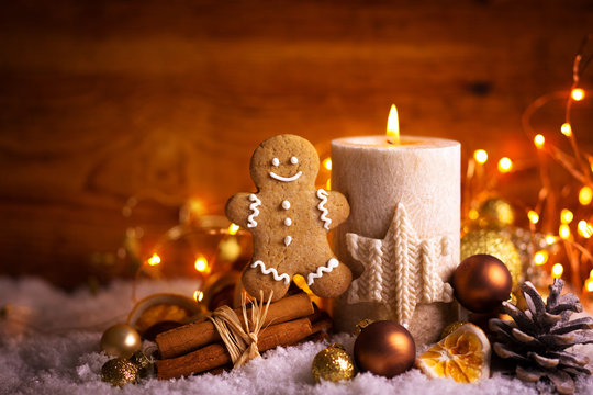 Christmas Background  -  Decorated candle light, gingerbread man and spices