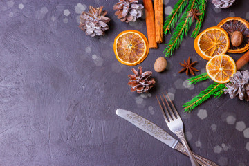 Christmas frame from fir tree branches and decorations on black background with space for text. Merry Christmas and Happy New Year. Xmas concept. Top view. Copy space