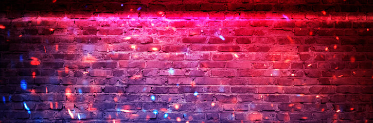 Empty brick wall background, night view, neon light, rays. Celebratory background. smoke