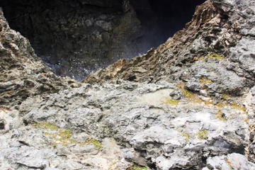 Close up of boulder and water