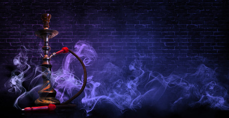 hookah on the background of a brick wall, neon light, smoke, smog,