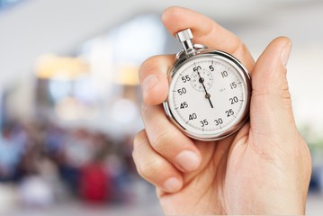 Stopwatch in Human Hand, sport concept