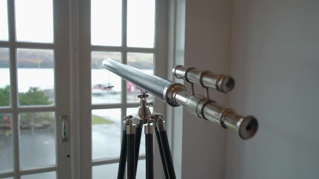 Telescope pointed out window during daylight