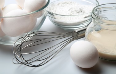 Fototapeta na wymiar Eggs, Flour, Yeast And Scutcher Close-up