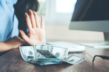 woman stop sign in money