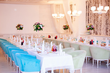 Birthday party concept. Flowers and tables in restaurant
