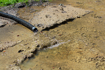 Water flowing out of a discharge hose