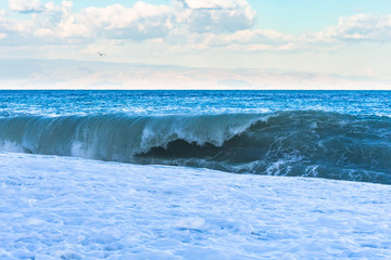Big waves at Taormina beach. Taormina, Sicily, Italy.