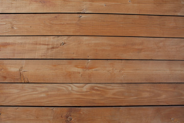 The varnished boards. The wooden textured background. The vertical plank