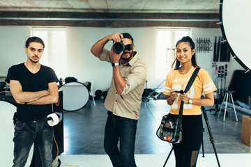 Photographer taking photograph in studio