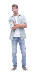 Fototapeta premium in full growth. smiling young man in jeans
