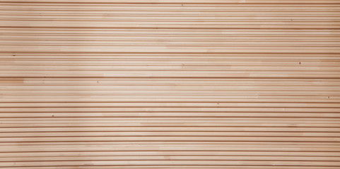 Folded wooden lining in a sawmill. Piled alder boards as texture