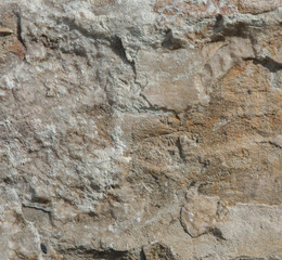 Structure of surface of the stone, used as background. Stone texture. Natural rocks
