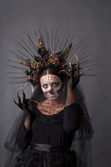 Closeup portrait of Calavera Catrina. Young woman with sugar skull makeup. Dia de los muertos. Day...