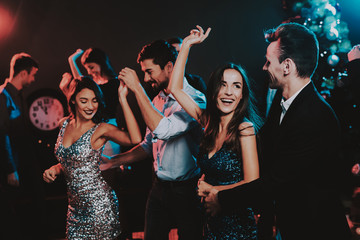 Happy Young People Dancing on New Year Party.