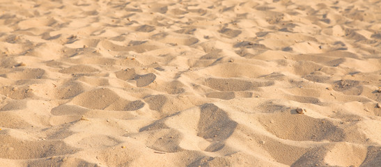 Closeup of sand pattern of a beach in the summer. Background.concept for summer season