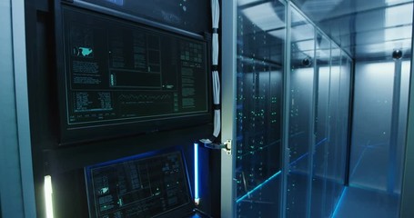 Close up shot of a computer login screen in a modern data center then appear message ddos attack