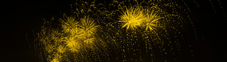 Colorful fireworks explosion in panorama format. Web banner. Ideal for New Year, Independence Day, Christmas or other celebrations.