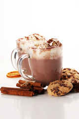 Hot chocolate cocoa with whipped cream on table.