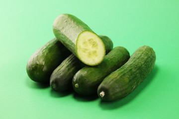 Fresh cucumbers on green. cucumbers for diet and healthy eating.