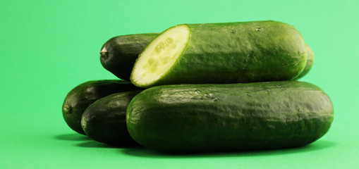 Fresh cucumbers on green. cucumbers for diet and healthy eating.