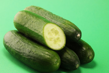 Fresh cucumbers on green. cucumbers for diet and healthy eating.