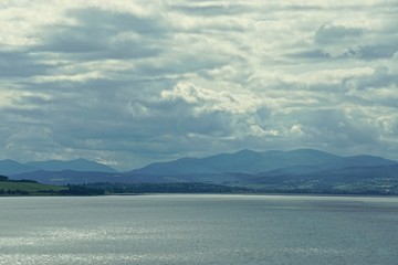 Thick white clouds over the Beauly Firth, an inlet of the Moray Firth, between the village of North Kessock and the city of Inverness in the Scottish Highlands.