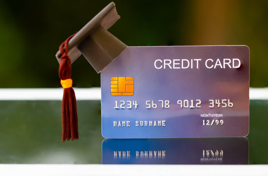 Education payment Credit Card for study Graduate concept: Graduation Cap on Mock up Card, Idea for dept loan playing for successs studying or business have to use so money and alternative risk finance