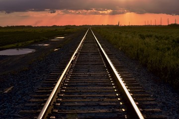 Obraz na płótnie Canvas railway tracks in sunset
