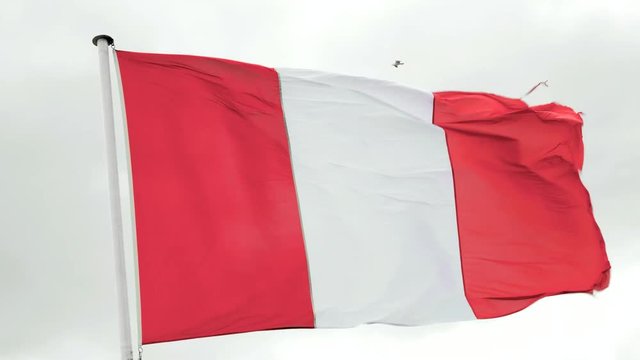 Flag of Peru waving in the wind on a cloudy day