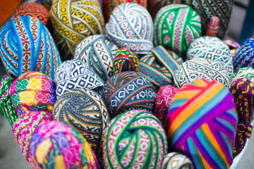 Fototapeta na wymiar Traditional colorful wool textiles sold in Cusco market, Peru.