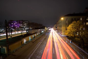 Deurstickers Night traffic in Vienna produces car light trails on multilane street Währinger Gürtel near the Vienna General Hospital AKH. © Timelynx