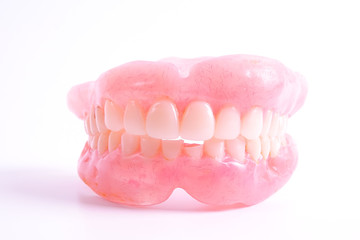 A set of dentures isolated on a white background.