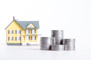 Model of a House with Stacks of a Coins
