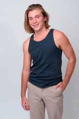 Fototapeta premium Young handsome man with long blond hair